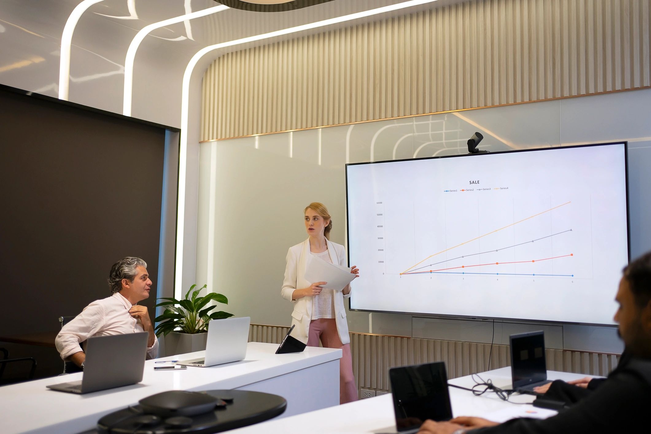 Team presenting go-to-market strategy in a meeting room